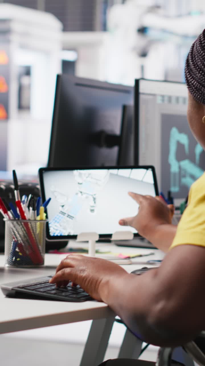 Vertical Video Photovoltaics factory worker with physical impairment using PC