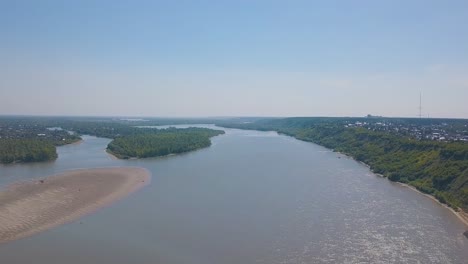 tranquil river with islands and green banks bird eye view