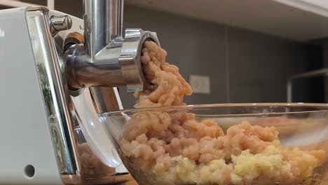 mincing chicken with meat grinder