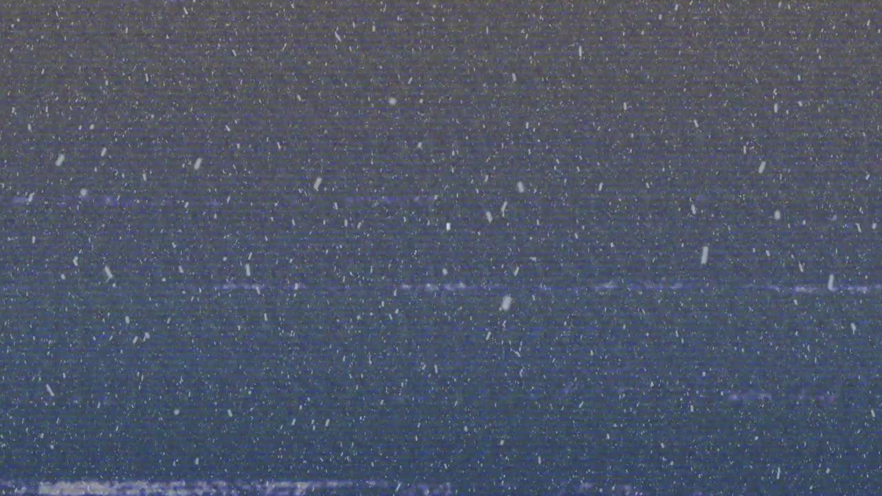 Frame advancing shifting static specks and drifting glitch lines simulating signal malfunction