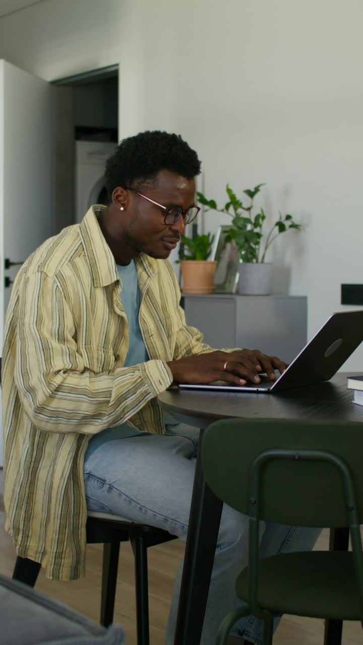 Man Working on Laptop at Home