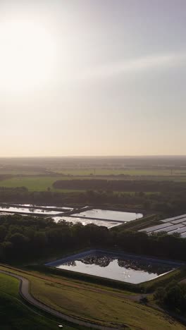 aerial view of a wastewater treatment plant with industrial ponds