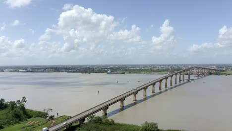 Drone-view-of-Jules-Wijdenbosch-bridge-captured-with-mavic-2-pro,-flyover-Suriname-river-in-port-of-Paramaribo,-capital-of-Suriname