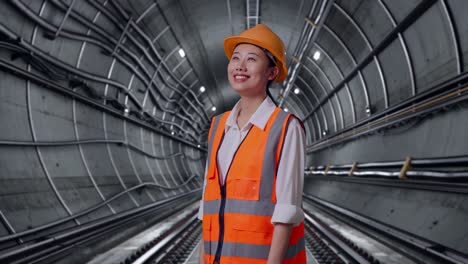 Female Engineer in a Subway Tunnel