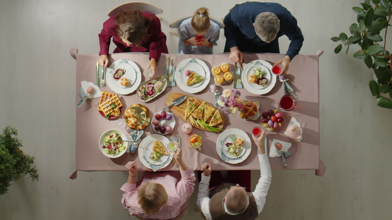 Top Down of Family Toasting on Easter Dinner