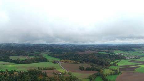 Rural-Landscape-With-Green-Fields-And-Forests-On-A-Cloudy-Day-Of-Autumn