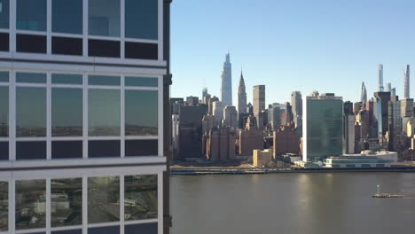 an aerial view from over queens, ny on a sunny day with blue skies