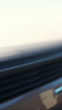 close up of a car's dashboard with air vents