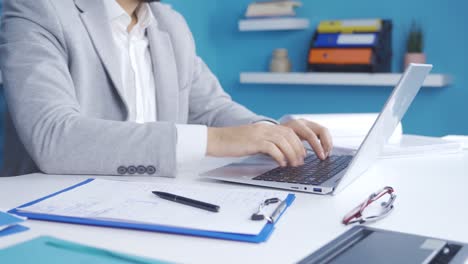 Close-up-of-young-businessman-working-in-office.