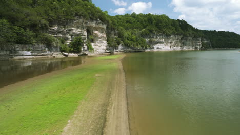 calm beaver lake with limestones cliffs in the ozark mountains of northwest arkansas, united states