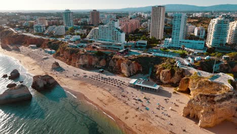 aerial view of coastal cliffs and beach life in portugal