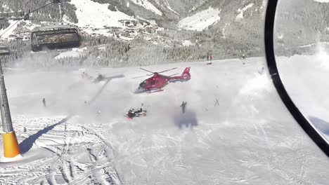 emergency helicopter starts from a ski lane in austria gerlos zilltertal