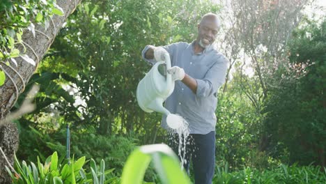 happy senior african american man working in garden