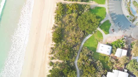 Drone-is-making-top-view-areal-video-shoot-over-residential-area-and-beach-coastline-of-Apollo-Bay-Beach,-VIC,-Australia