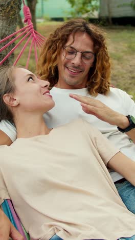 couple relaxing in a hammock
