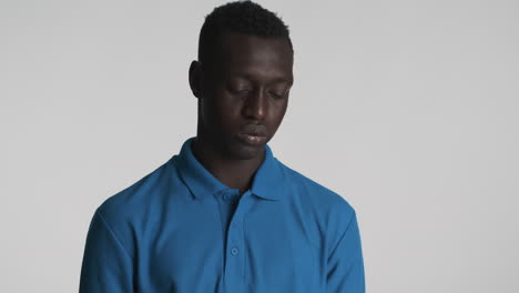 Tired-African-american-man-on-grey-background.