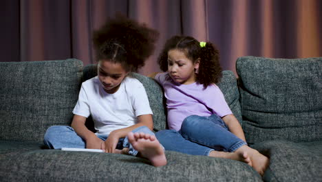 kids sitting on the sofa at home