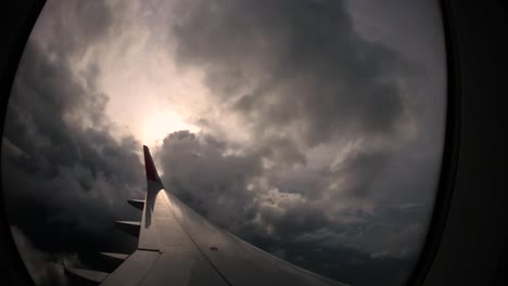 sunset and lovely clouds from the window of the left wing of the airplane brings back travel memories