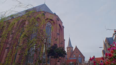 Traditional-European-Dutch-style-cathedral-chapel-architecture-building-in-Netherlands-with-flowers,-authentic-art-design-and-sightseeing-walkthrough