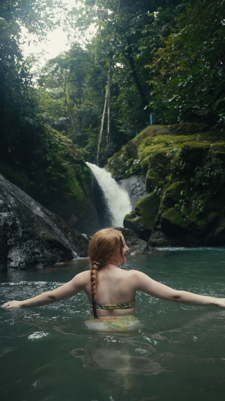 Woman Enjoying Waterfall in Tropical Nature
