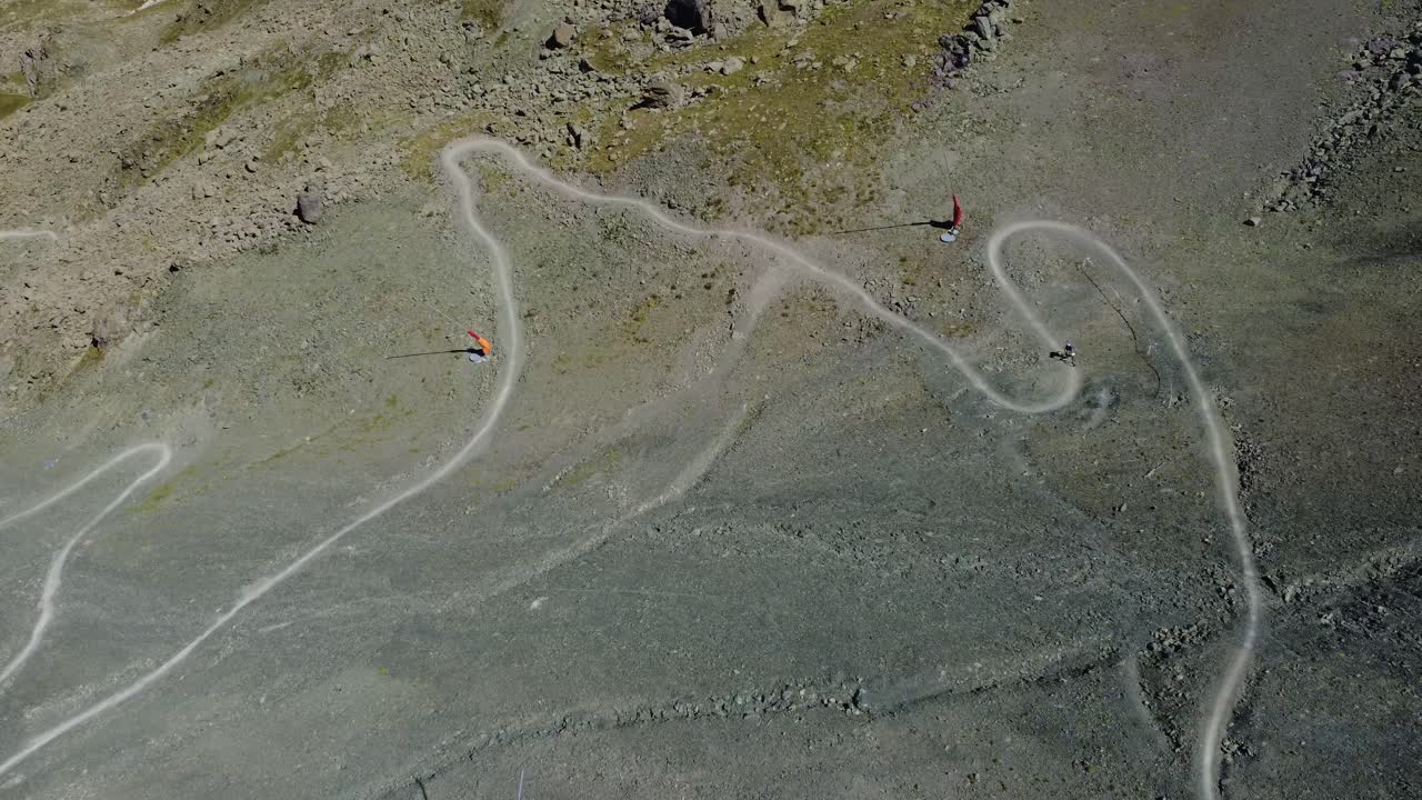 Fast-paced point-of-view clip of a mountain biker descending the Ischgl flowtrail through rugged alpine terrain