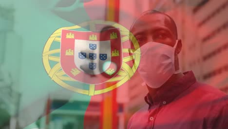 Animation-Der-Flagge-Portugals,-Die-Während-Der-Covid-19-Pandemie-über-Einem-Mann-Mit-Gesichtsmaske-Winkt