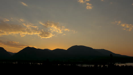 Sunset-time-lapse-of-lake-and-mountains