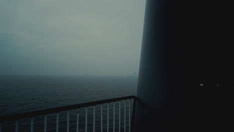 filming a ship in the midle of the ocean, with a lot of fog