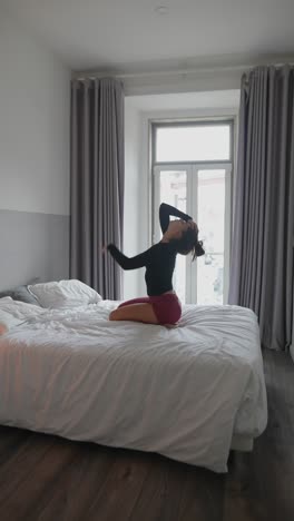 Woman Posing in a Bedroom