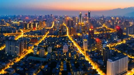 dusk skyline with twinkling lights. dusk city skyline with glowing lights and buildings silhouetted against a vibrant sunset.