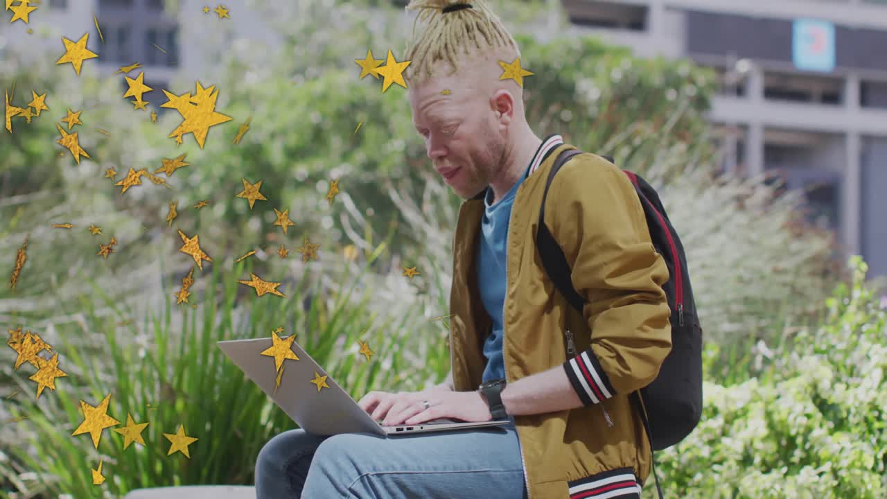 tech student typing on laptop as animated stars entering left passing screen dissipating