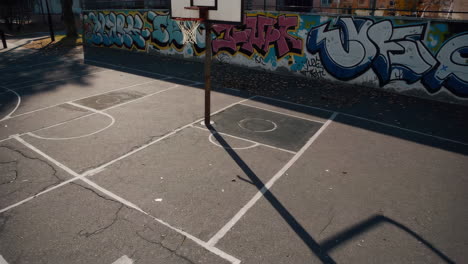 graffiti-covered basketball court
