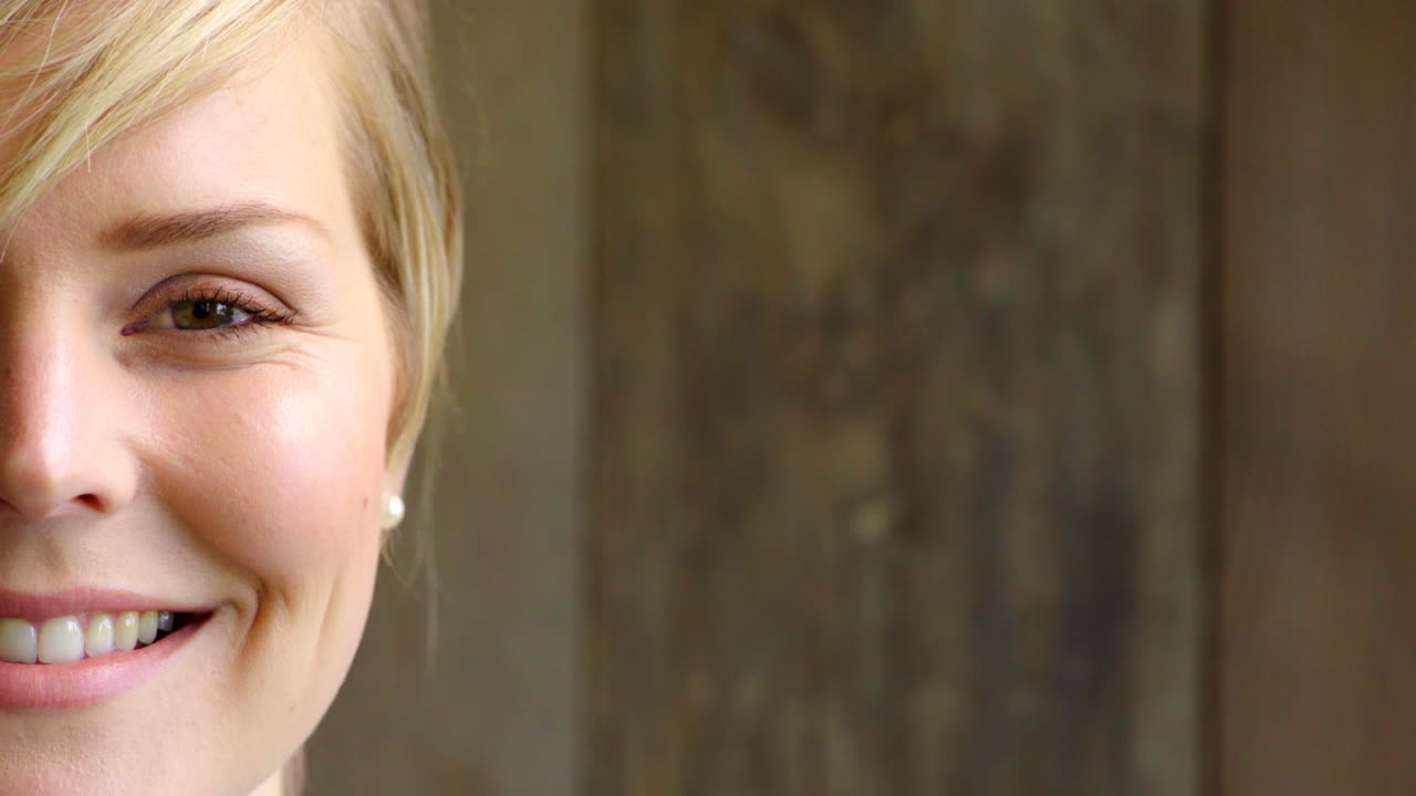 Half face of a happy female professor isolated