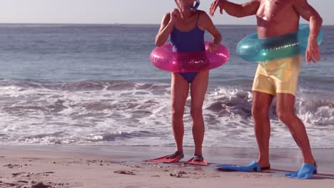 Happy-senior-couple-having-fun-with-water