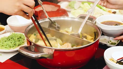 friends share a hotpot meal together