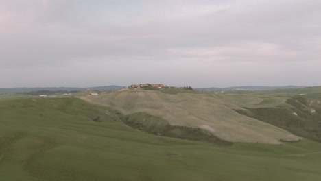 a historic city up on a hill in tuscany