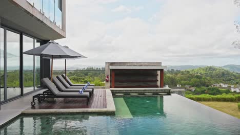 Cinematic-slider-showing-double-story-luxury-villa-with-infinity-pool