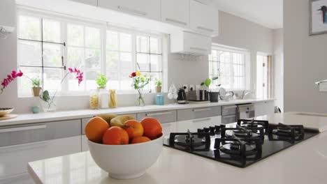 video of bowl of oranges in modern and bright kitchen