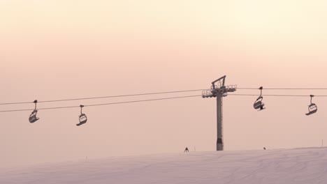 ﻿﻿Skiers-ride-chair-lift-to-top-of-ski-run-Myrkdalen-Resort,-Norway