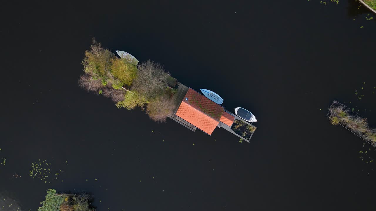 Small recreational houses at Scheendijk, water and recreational area, Loosdrechtse plassen. Aerial drone video