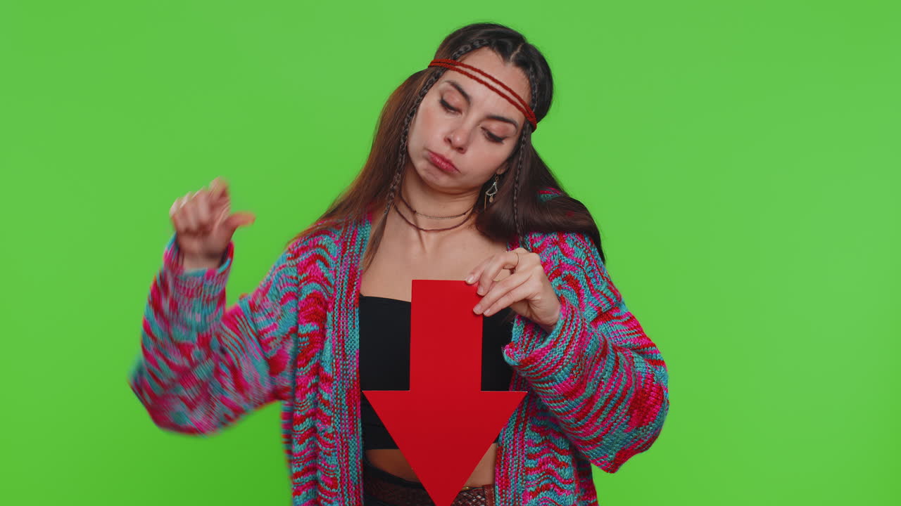 Upset sad woman showing red arrow pointing down concept of downgrade bankruptcy money fail fall