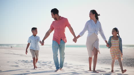 Family,-parents-and-children-on-beach-with-holding