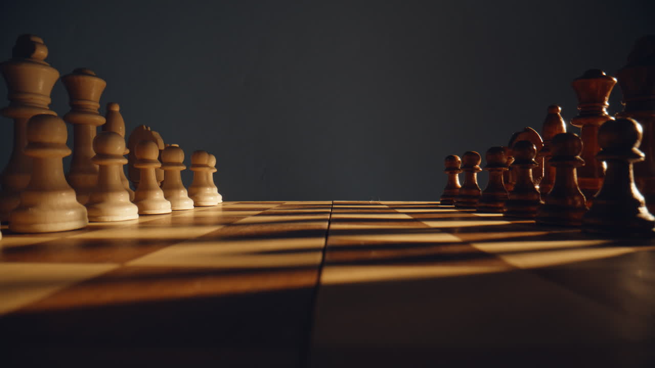 Closeup people competing chess on checkered board indoors. Strategic game hobby