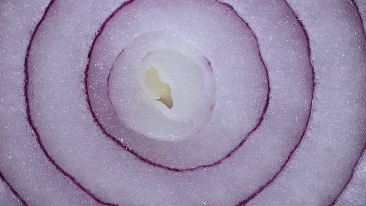 Texture Red Onion Rings Rotating, Close-up Top View. Harvested  Healthy Food Background With Vegetable Of Rich Vitamin. Sweet Red Spanish Onion Macro Shot. Food Background Closeup Sliced Purple Onion