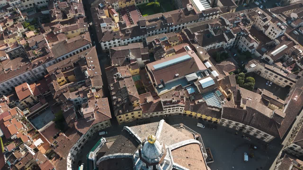 Close drone shot of the Florence Duomo dome, revealing its ornate brick patterns and timeless architectural detail