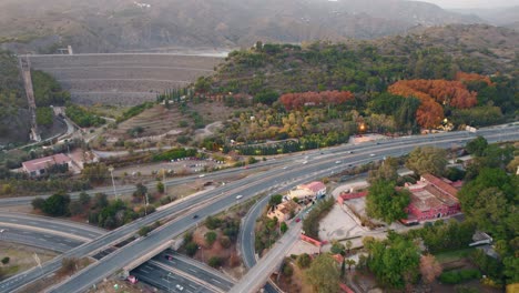 aeiral view of the jardin botánico in málaga, spain located betweena a dam and a highway