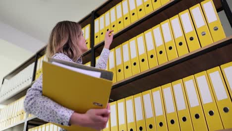 Woman organizing files in office