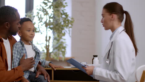 doctor examines a child