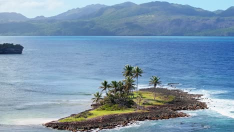 telephoto aerial orbit tiny lonely caribbean paradise island with palm trees