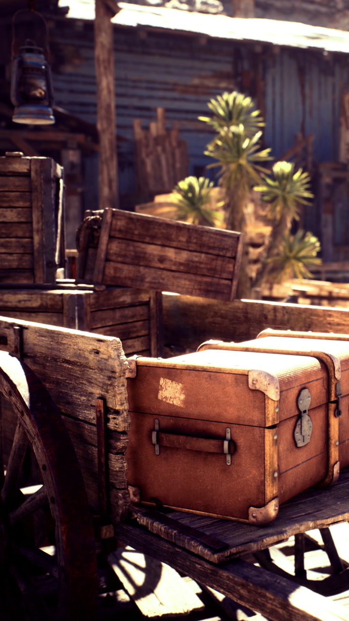 Beautiful rustic wagon filled with old wooden crates in a sunlit scene